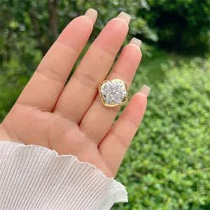 Adjustable 18K gold plated snowflake ring with cubic zirconia crystals shown on finger