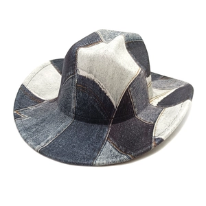 Top view of patchwork denim cowboy hat with vintage stitching and irregular contrast colors