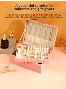 Pink leather double-layer jewelry box featuring necklace hooks and ring slots in detail