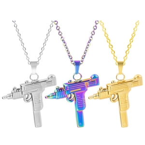 Detailed comparison of Uzi pendant necklaces in silver, gold, and rainbow finishes