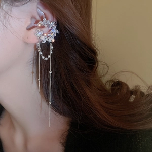 Detail of silver leaf ear cuff with zircon flower clusters and pearl tassel chains
