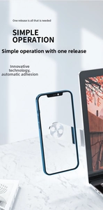 Close-up of magnetic aluminum dual-screen phone mount attached to a laptop side