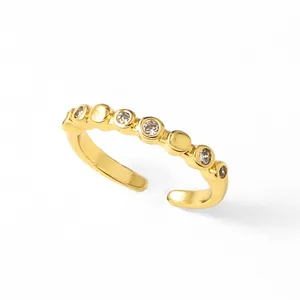 Adjustable 18K gold plated wavy open ring with sparkling round cubic zirconia accents