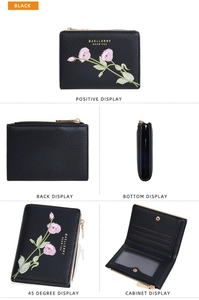 Close-up of black floral embroidered wallet with multiple card slots and zip pocket