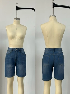 Front and back view of dark blue high-waisted denim shorts with vintage wash and five pockets