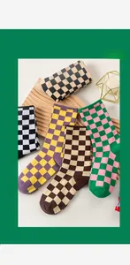 Macro shot of assorted colorful checkerboard pattern socks on a wooden wave display