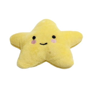 Detailed close-up of yellow star-shaped plush dog toy with soft textured fabric
