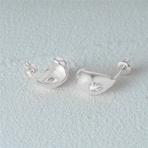 Macro shot of S925 sterling silver C-shape stud earrings with polished pear-shaped zircon
