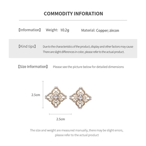 Detailed view of hollow diamond-shaped earrings with zircon inlay and product dimensions
