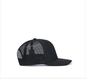 Side view of black mesh trucker hat showing curved brim and breathable back panels