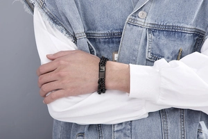 Close-up of men's double-layered black stainless steel bracelet with magnetic clasp