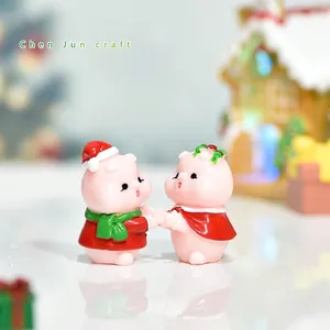 Miniature Christmas pig figurine set with festive hats and scarves for holiday decor