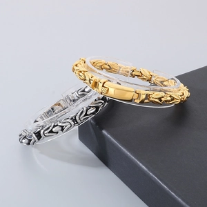 Detail of gold and antique silver Byzantine chain bracelets with secure folding clasps