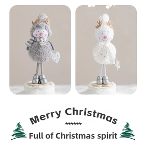 Detailed view of gray and white plush Christmas snowman figurines with reindeer antlers