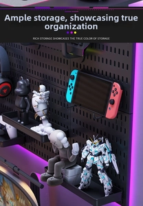 Detailed view of black pegboard wall organizer with shelves in a gaming setup