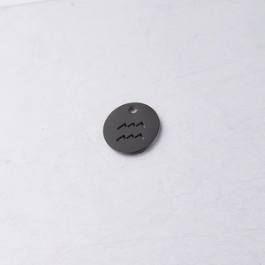 Close-up of a 12mm black stainless steel Aquarius zodiac charm with a hollow pendant design