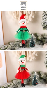 Detail of Christmas elf plush ornaments with mesh skirts and tiny golden bells