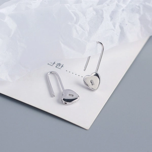 Macro shot showing the 925 sterling silver hallmark on the heart lock earrings