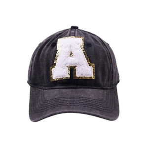 Distressed washed denim baseball cap with a white sequined towel embroidery letter A patch