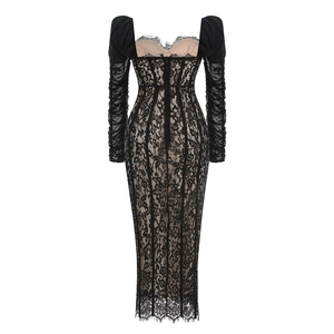 Close-up of black lace fishtail dress back featuring nude mesh lining and hidden zipper