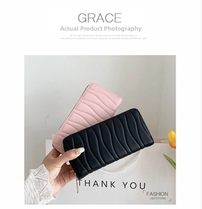 Chic long PU leather zip wallets with wavy quilting shown in pink and black colors