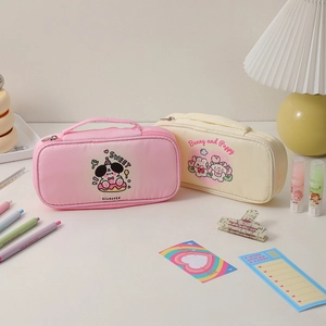 Detail of pink and cream large capacity pencil cases with double zippers and top handles