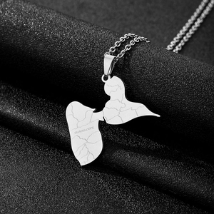 Detail of silver Guadeloupe map pendant in titanium steel with textured surface finish