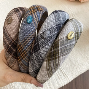 Close-up of thick sponge headbands with assorted color plaid twill fabric patterns