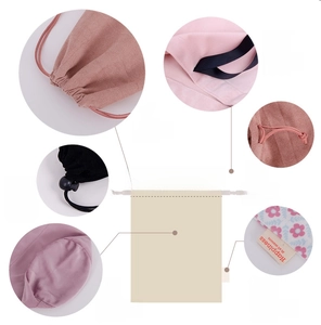 Detail showing colorful velvet drawstring pouches with various cord locks and round bottoms