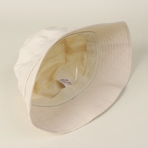 Premium cream embroidered grid bucket hat with breathable mesh lining for summer travel
