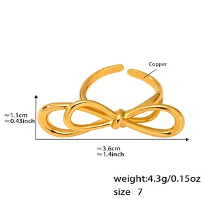 Detail showing 3.6x1.1cm golden bow knot ring measurements and copper material details