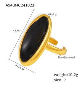 Detail of a chunky gold oval stainless steel ring with black enamel inlay, size 7