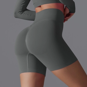 Detail of seamless charcoal grey high-waisted yoga shorts with ribbed waistband and contouring