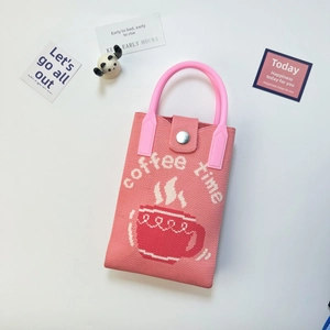 Pink knitted phone bag with coffee time embroidery and round top handle detail