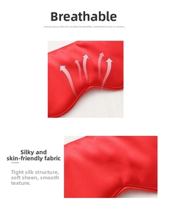 Detail of red faux silk sleep mask showing breathable fabric texture and soft satin gloss