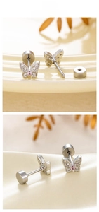 Detail of butterfly stud earring with pink zircon and white micro-pave crystal butterfly