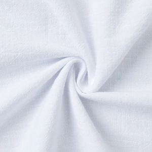 Macro shot of pure white cotton fabric showing detailed breathable weave and texture