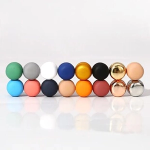 Macro view of assorted metallic and matte spheres for DIY jewelry making material