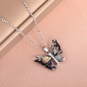 Elegant butterfly pendant necklace with layered acrylic wings and sparkling zircons