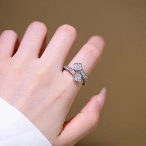 Elegant silver clover ring with sparkling crystals in an adjustable open band design