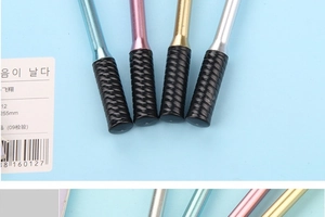 Detail of colorful badminton racket pens with 255mm metal shafts and black textured grips