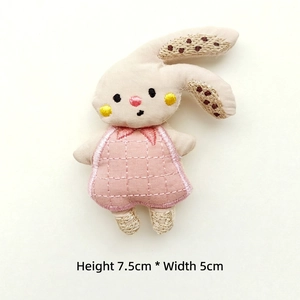 Pink fabric bunny patch with checkered dress and embroidery, measures 7.5cm by 5cm
