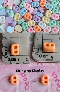 Close-up of 11mm colorful letter B resin beads with double holes for DIY jewelry