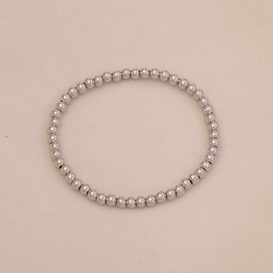 Detailed top view of a polished silver ball bead bracelet with a minimalist metallic finish