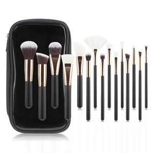 14-piece makeup brush set with black handles and rose gold ferrules in a black leather case