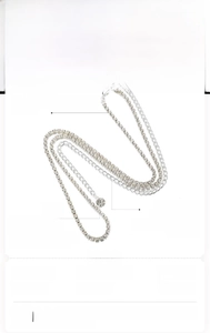 Detail of rhinestone waist chain featuring round diamond pendant and adjustable extension link