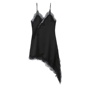 Detail of black silk dress with delicate lace trim and asymmetric hemline