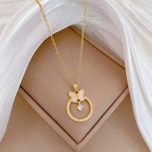 Luxurious gold butterfly necklace with pearl shell pendant and sparkling zircon ring