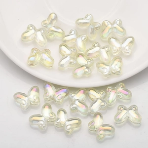 Macro shot of butterfly glass beads with aurora finish for DIY jewelry crafts