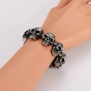 Retro stainless steel skull link bracelet in vintage silver finish for a gothic punk style